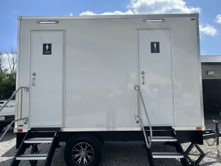 Mobile trailer restroom from Love's Restroom Rentals.