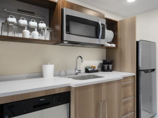 The kitchen in the rooms at Home2 Suites